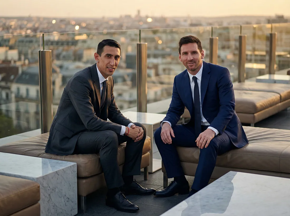 Baja_Firefly_Gemini Flash_Ultra-realistic cinematic photograph of Lionel Messi and Ángel Di María sitting toget 943972